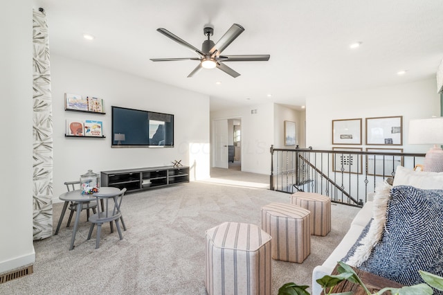 living room with ceiling fan and light carpet