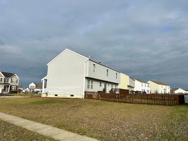 view of property exterior with a yard