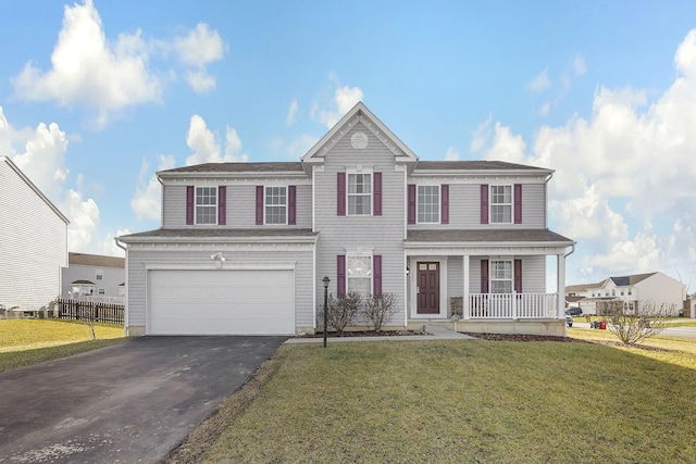 view of front of house featuring a porch, a garage, and a front lawn