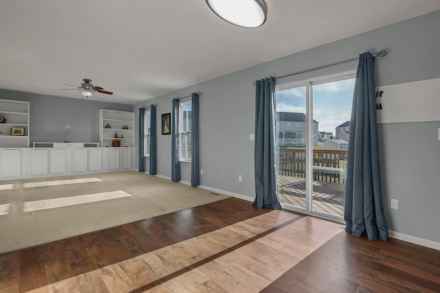 unfurnished room featuring hardwood / wood-style floors and ceiling fan