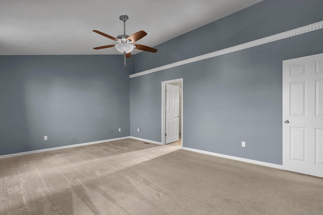 unfurnished room featuring ceiling fan, light colored carpet, and lofted ceiling