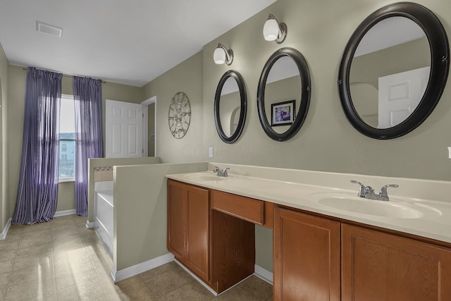 bathroom featuring a bathtub and vanity