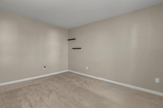 unfurnished room with light colored carpet