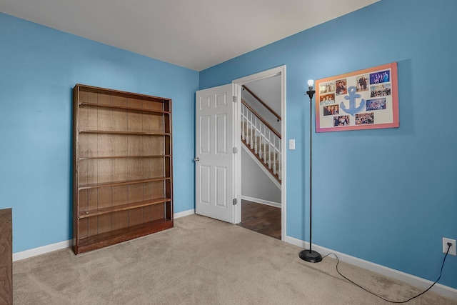 unfurnished bedroom with light colored carpet