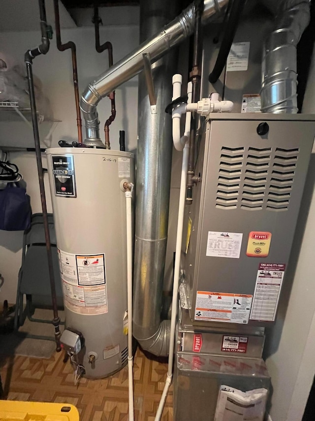 utility room with water heater