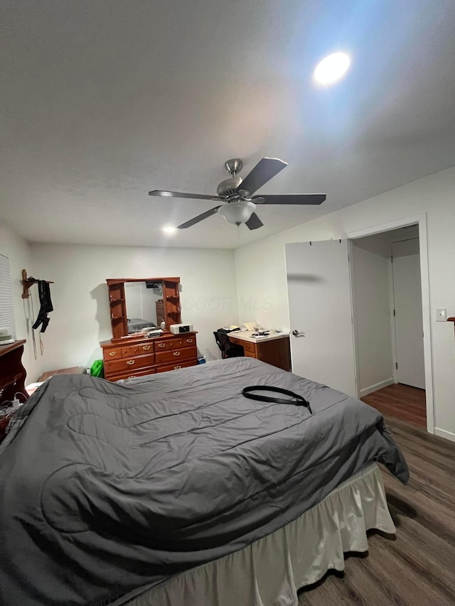 bedroom featuring ceiling fan and dark hardwood / wood-style flooring