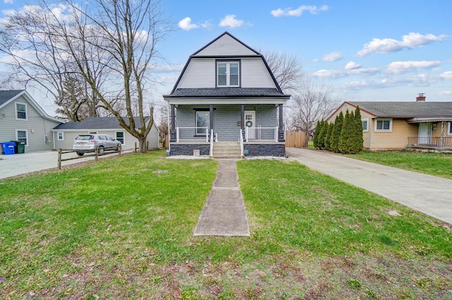 bungalow with a front yard and a porch