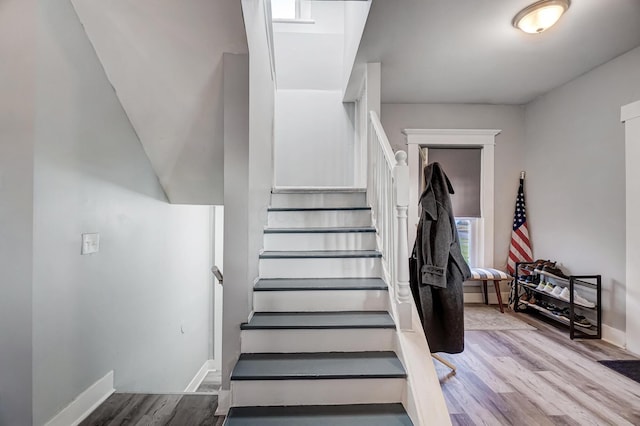 stairway featuring hardwood / wood-style flooring