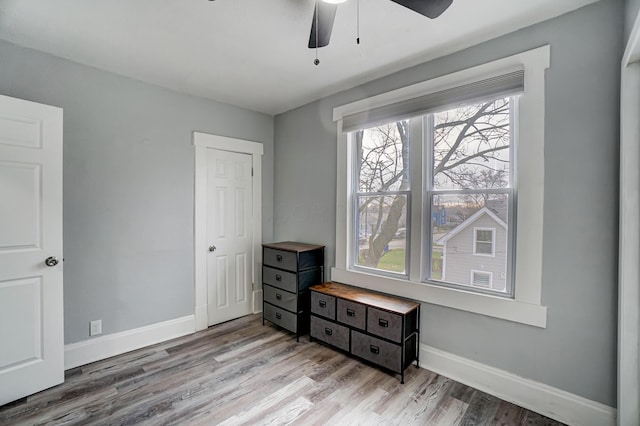 bedroom featuring ceiling fan and light hardwood / wood-style flooring