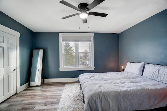 bedroom featuring ceiling fan and light wood-type flooring