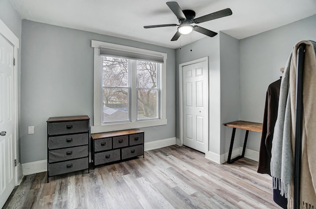 bedroom featuring a closet, ceiling fan, and light hardwood / wood-style flooring