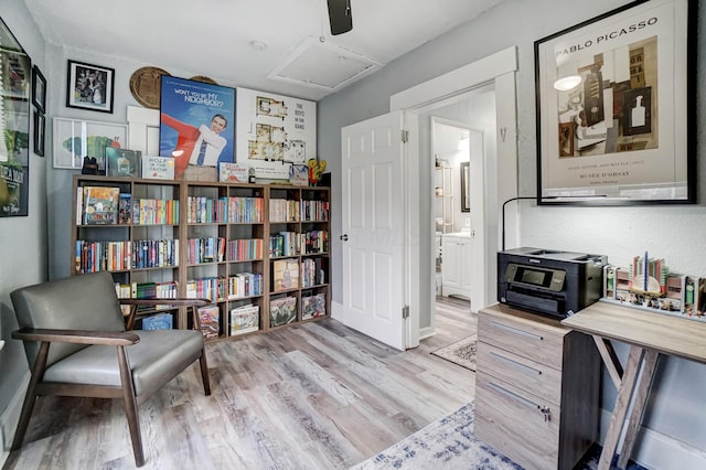 sitting room featuring ceiling fan and light hardwood / wood-style flooring