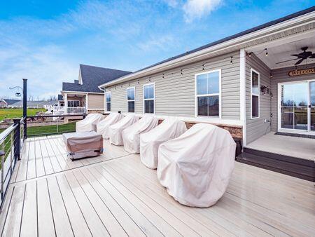 wooden terrace featuring ceiling fan