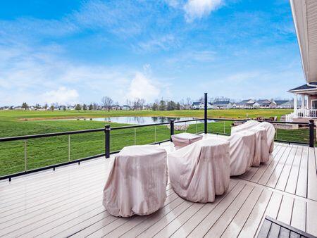 wooden terrace featuring a water view