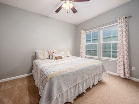 bedroom featuring carpet flooring and ceiling fan