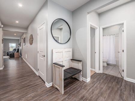 hallway with dark wood-type flooring