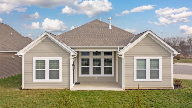 rear view of house with a patio area and a yard