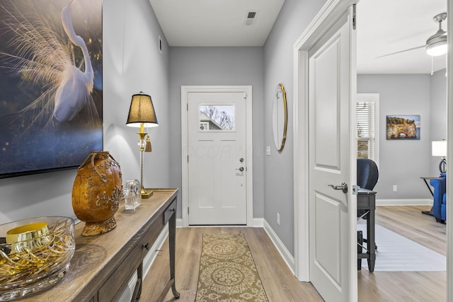 entryway with light hardwood / wood-style floors, plenty of natural light, and ceiling fan