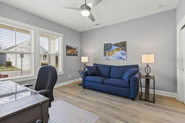 office with ceiling fan, a healthy amount of sunlight, and light hardwood / wood-style floors