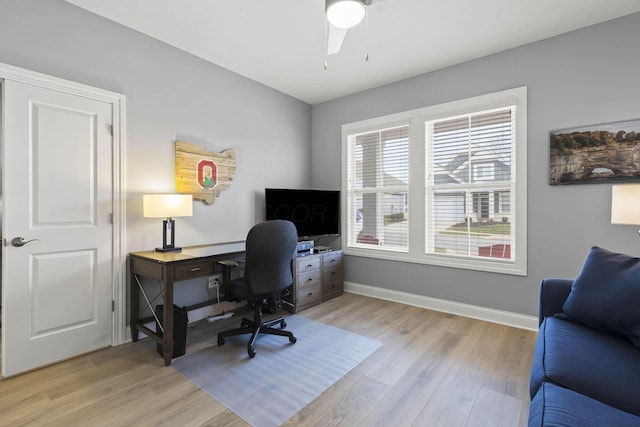 office area with light hardwood / wood-style floors and ceiling fan