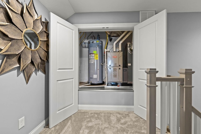 utility room with electric water heater