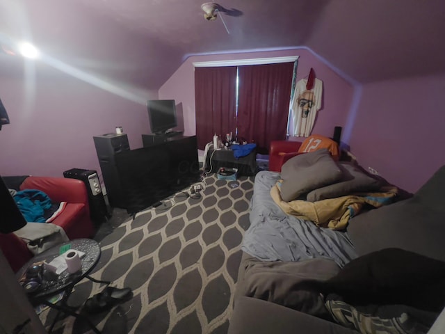 bedroom with lofted ceiling