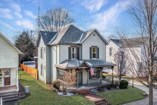 view of front of property featuring a front lawn and a porch