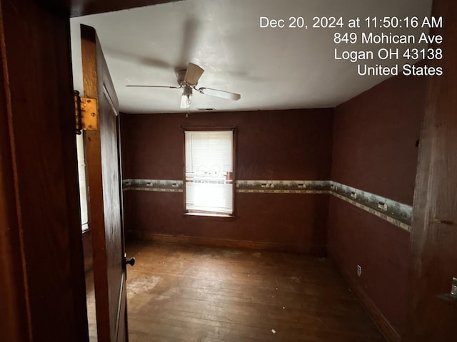 unfurnished room with ceiling fan and hardwood / wood-style floors