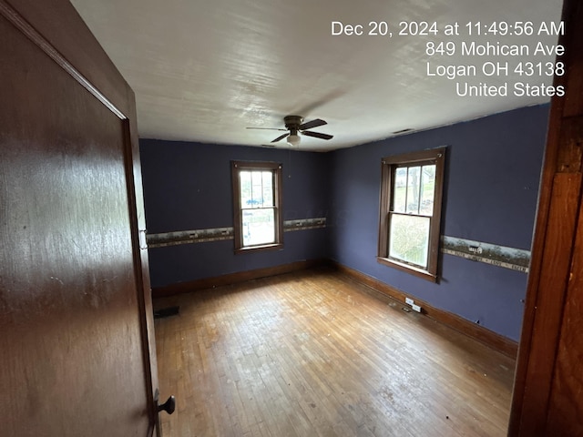 spare room featuring hardwood / wood-style flooring and ceiling fan