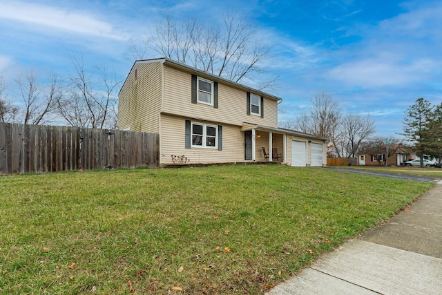 front of property featuring a garage and a front lawn