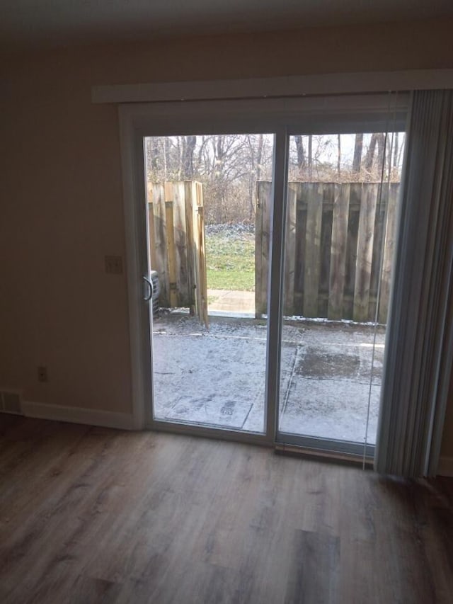 doorway to outside featuring hardwood / wood-style floors