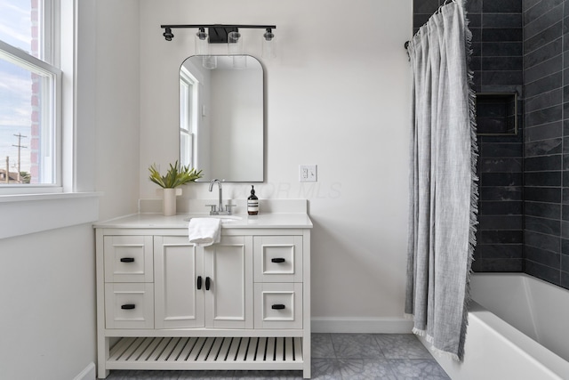 bathroom with shower / bath combo with shower curtain and vanity