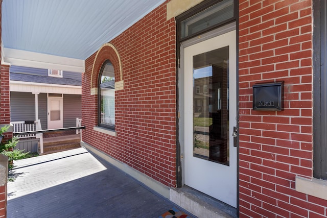 doorway to property with covered porch