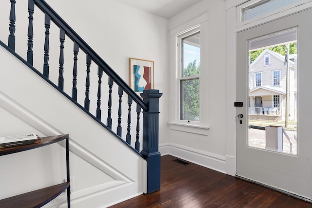 entrance foyer featuring dark wood-type flooring