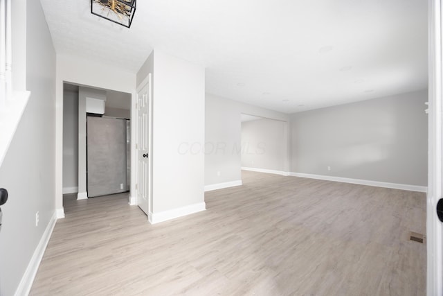 spare room with light wood-type flooring