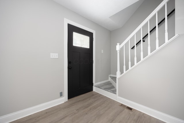 foyer with light hardwood / wood-style floors