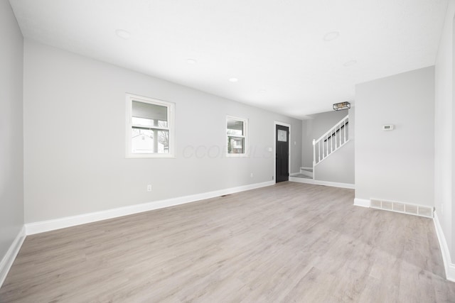 unfurnished room featuring light wood-type flooring