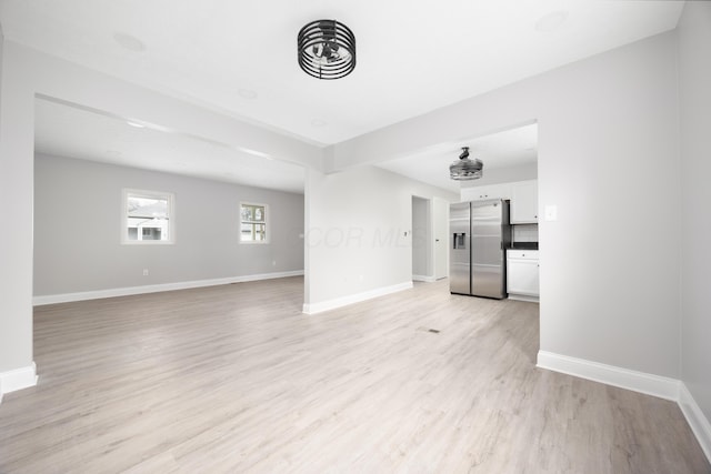 unfurnished living room with light wood-type flooring