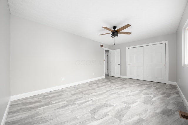 unfurnished bedroom with a closet and ceiling fan