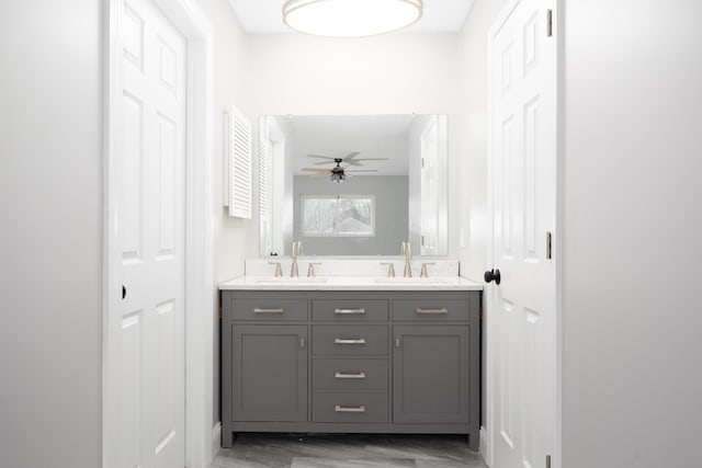 bathroom featuring hardwood / wood-style floors, ceiling fan, and vanity