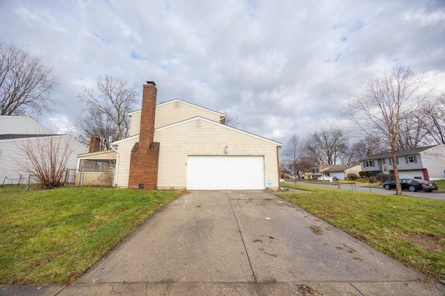 view of home's exterior featuring a sunroom, a yard, and a garage