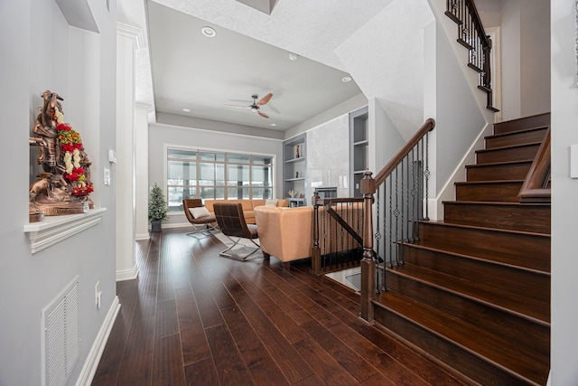 foyer entrance featuring ceiling fan and dark hardwood / wood-style floors