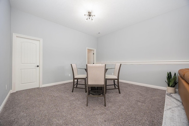 view of carpeted dining space