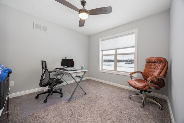 carpeted office with ceiling fan