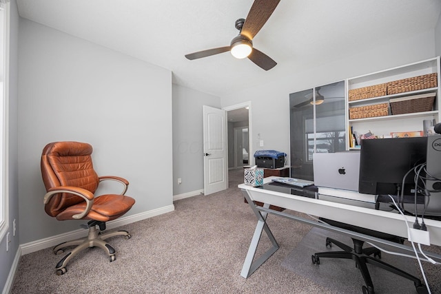 carpeted office with ceiling fan