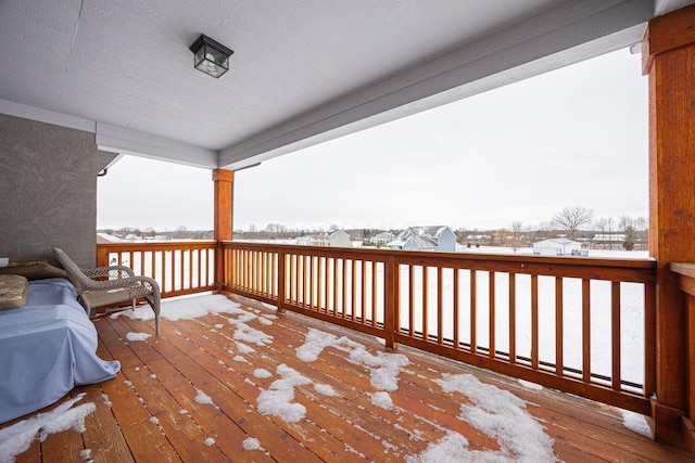 view of snow covered deck