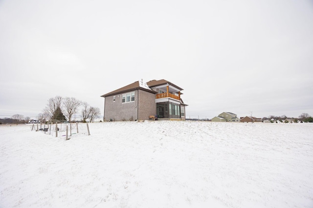 view of snow covered house