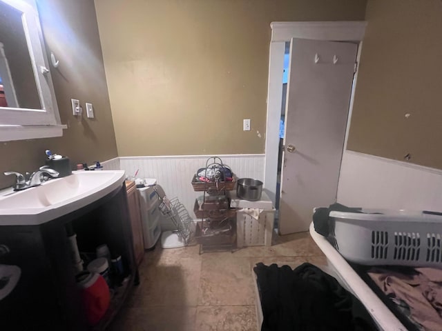 bathroom with tile patterned floors and vanity