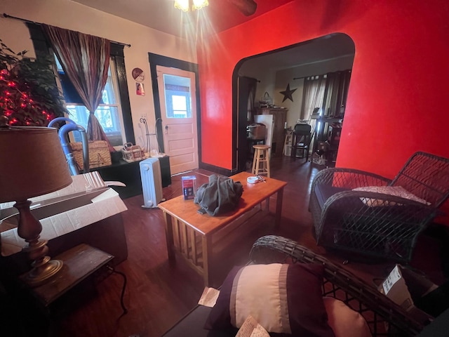 sitting room with dark wood-type flooring