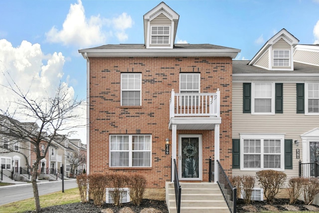 multi unit property featuring a balcony